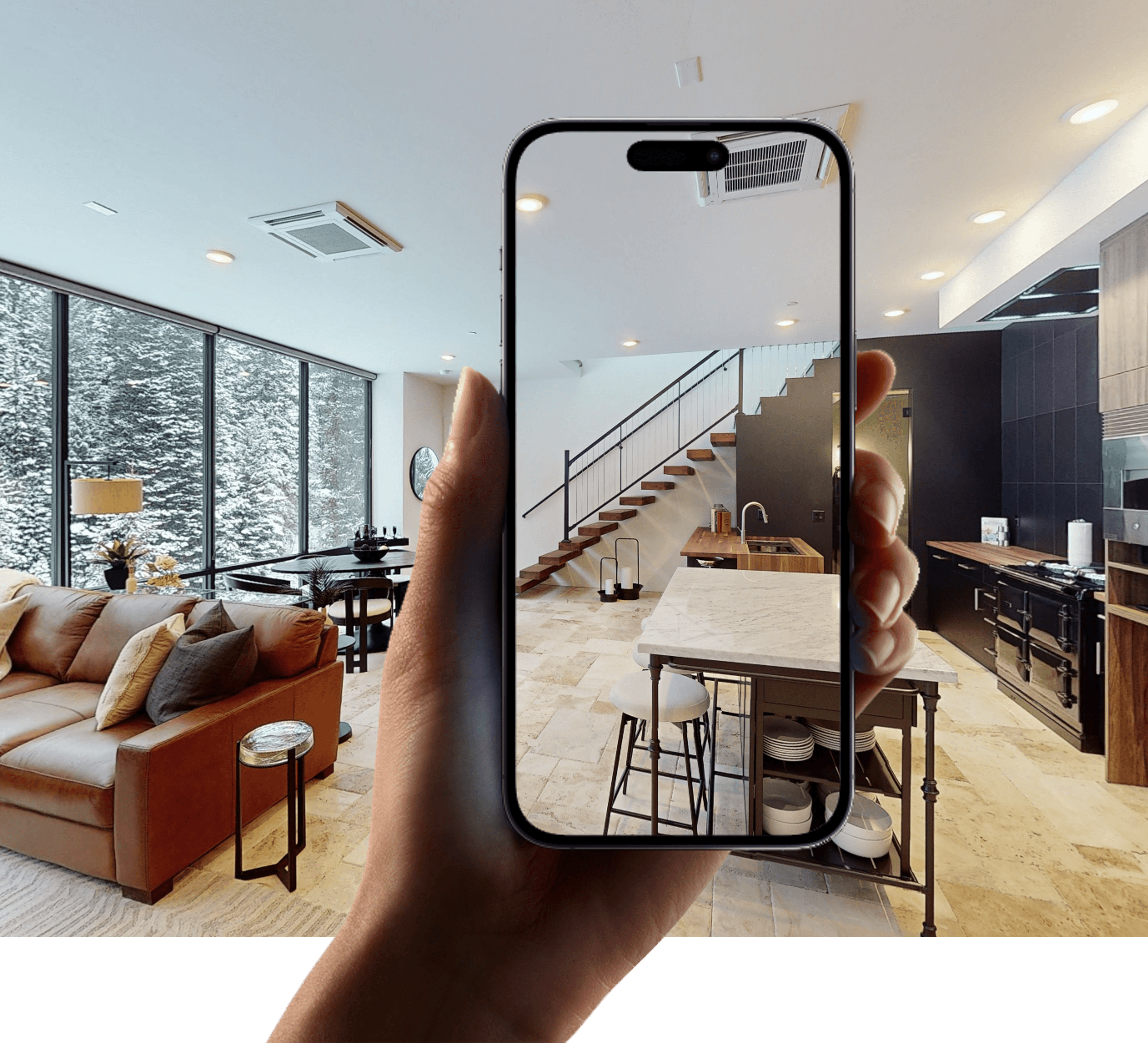A phone held up in the penthouse, its screen showing the virtual tour of the kitchen and stair